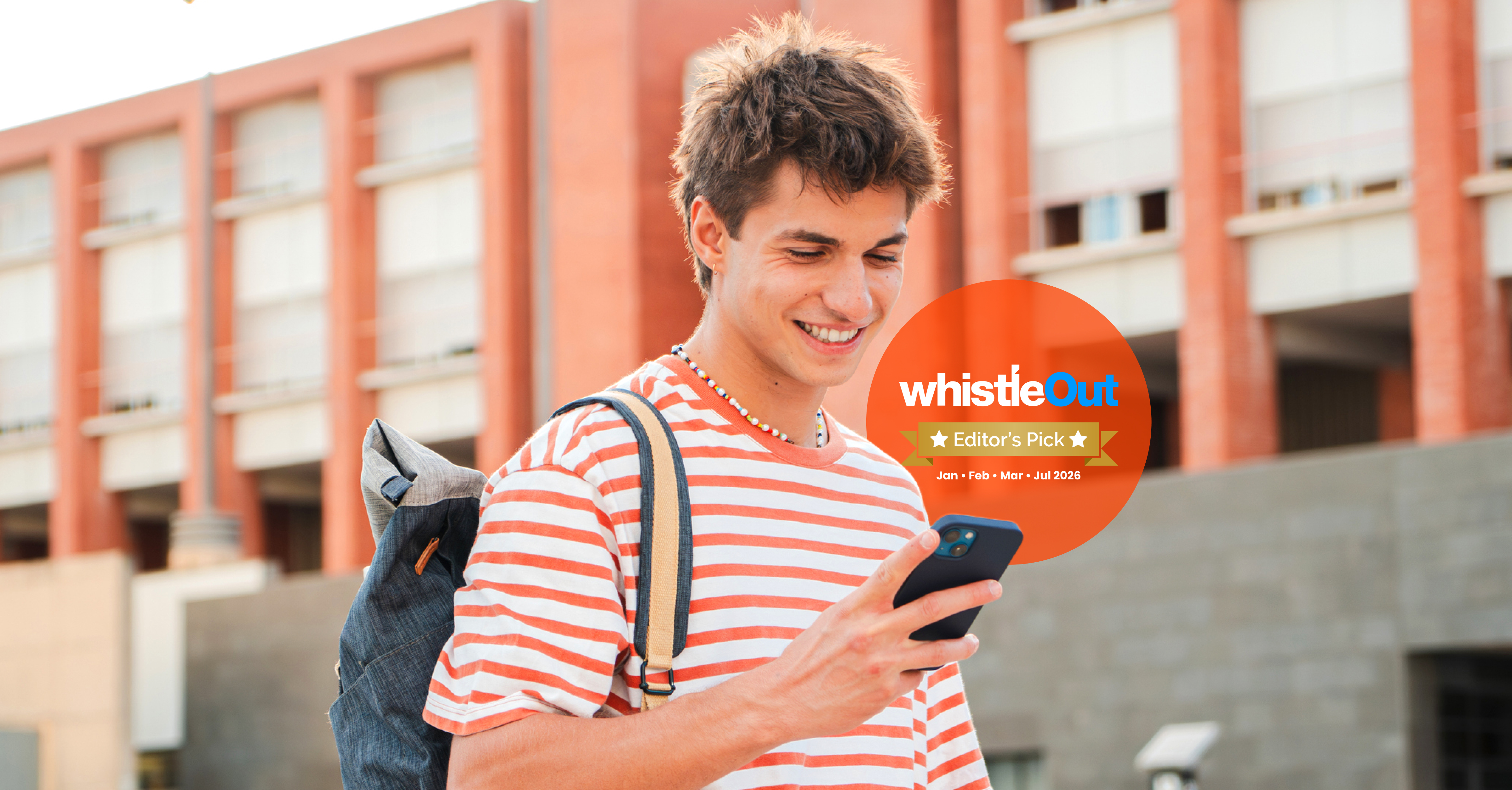 Yomojo customer checking his phone beside a WhistleOut Editor’s Pick badge for the Starter 29GB prepaid mobile plan.